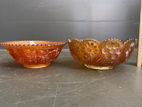 2 beautiful marigold carnival glass dishes, one with flower pattern and one with rose pattern