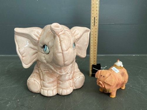 Ceramic elephant and mini chicken on a pig figurine