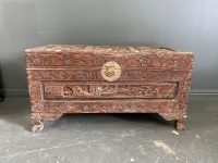 Small carved wooden chest with brass fittings