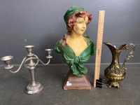 Statue of of woman, candle holder and golden jug