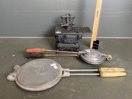 Reproduction mini cast iron wood burning stove, a jaffle maker and waffle iron