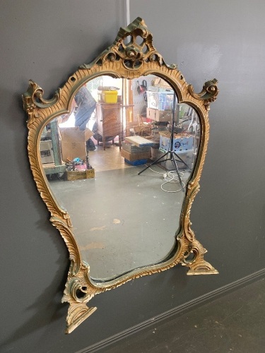 Large antique mirror in ornate frame