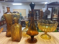 Amber glass collection including pedestal bowl