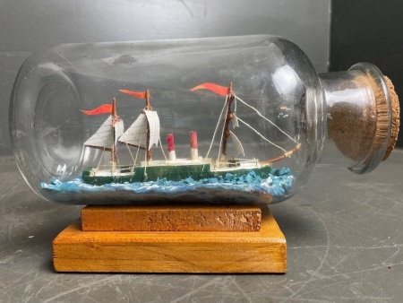 Model Boat in Bottle - Mounted on Timber Stand - app. 200mm long