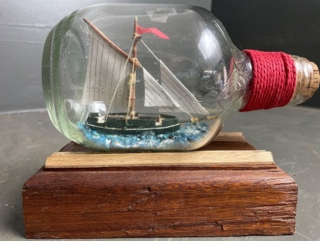 Model Boat in Bottle - Mounted on Timber Stand - app. 180mm long