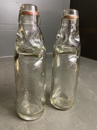 Pair of Gillham & Co marble stopper bottles