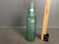 E. ROWLAND Green Glass Codd Neck Bottle with Marble and Embossed Lettering - chips to top - 250mm(H)