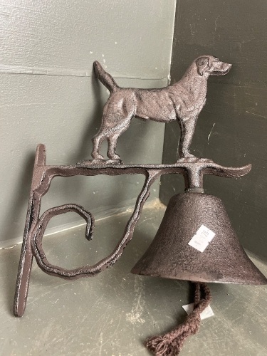 Dog with bell on bracket in iron