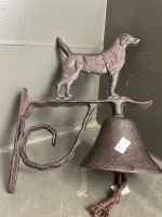 Dog with bell on bracket in iron