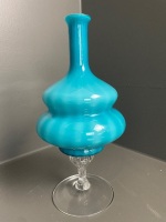 Turquoise glass vase centrepiece