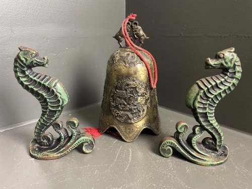 Pair cast iron seahorses and large brass bell