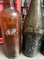 2 crates of collectors bottles coloured glass including NT stubby x 2 and amber demijohns plus others - 7