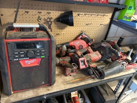 Various 18v Milwaukee tools with charger/radio