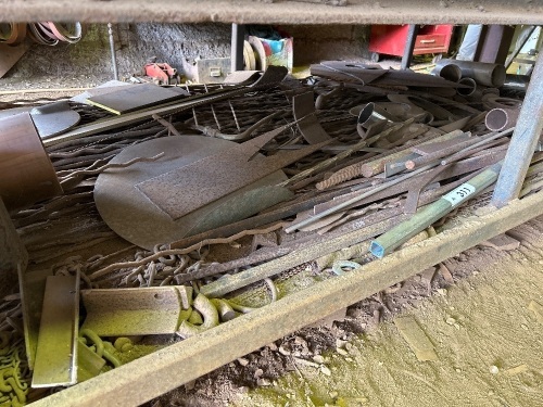 Assorted metal pieces under bench