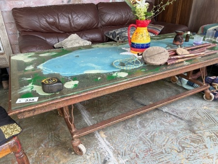 Painted glass top table on steel base with castors