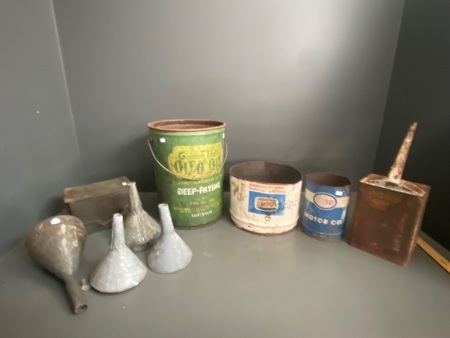 Selection of vintage oil tins and galvanized funnels