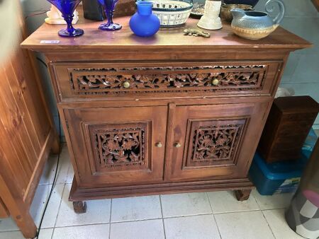 Carved timber cabinet