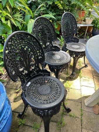 3 heavy cast iron chairs