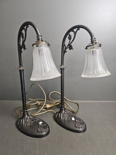 Pair of bronze look Art Deco style lamps with spare shade