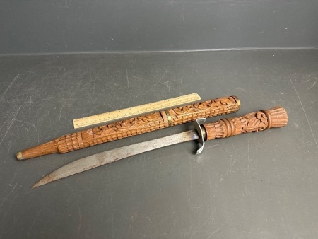 Small sword with carved wooden handle and sheath