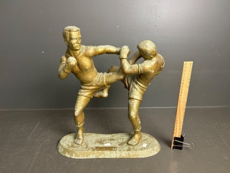 Cast alloy statue of kick boxers