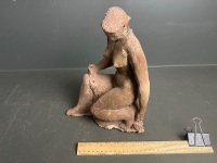 Clay sculpture of woman posing - 4