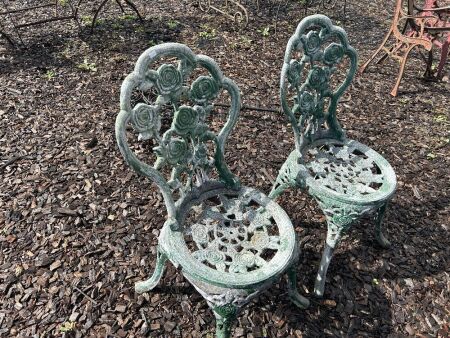 2 cast alloy chairs