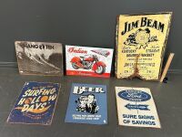 Assortment of printed tin signs