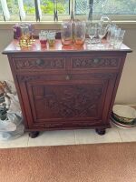 Small carved wooden sideboard