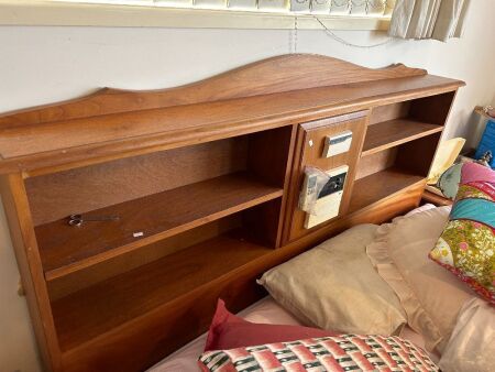 Wooden headboard with shelving and radio