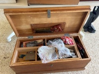 Wooden toolbox containing various tools