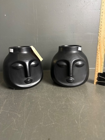 Pair of Unusual Black Ceramic Face Vases