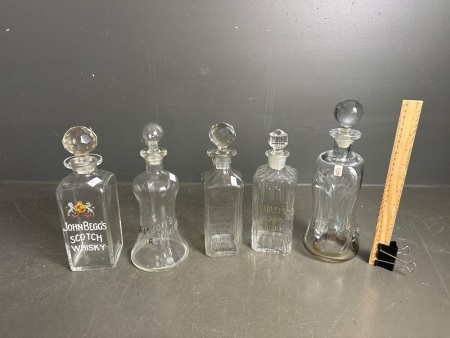 Assorted glass whisky decanters