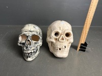 2 ceramic human skulls - 1 signed Peter Howarth 27.7.89