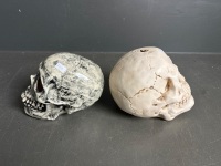 2 ceramic human skulls - 1 signed Peter Howarth 27.7.89 - 2