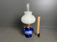 English ceramic oil lamp with brass double burner and white glass shade