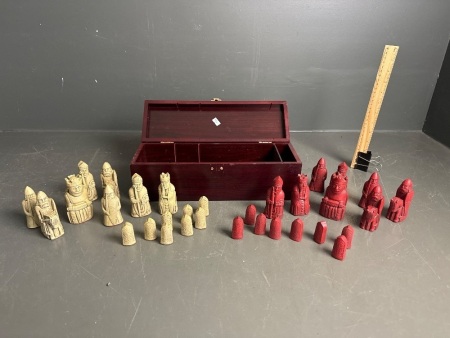 Box of carved chess pieces