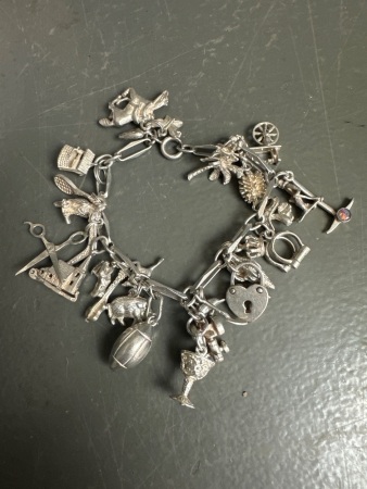 Vintage Sterling Silver charm bracelet with over 30 charms
