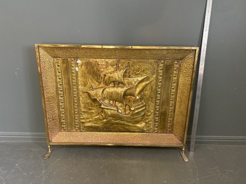 Embossed brass fire screen