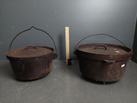 2 cast iron footed camp ovens