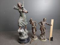 Three Bronze Look Statues