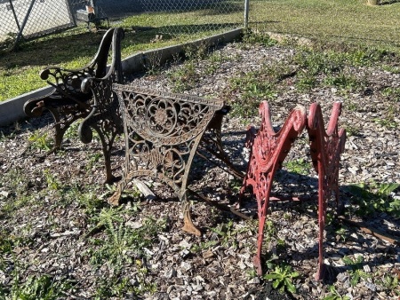 Cast iron lot inc. 2 pair of heavy-duty cast iron decorative bench ends and 1 pair of cast iron table stands