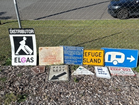 Assortment of printed tin signs