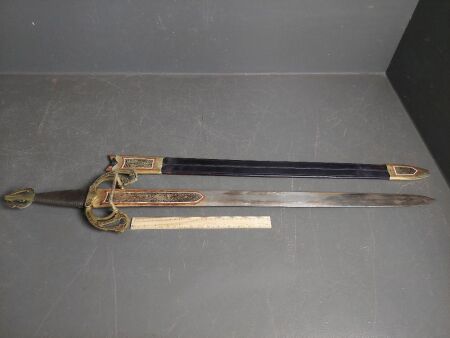 Medieval look ceremonial/display sword with brass hilt and string bound handle in leather sheath with brass trim