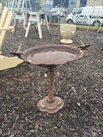 Cast iron bird bath with birds