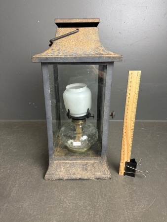 Vintage metal lantern with oil lamp