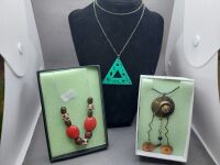 3 Necklaces - 1 Polished Wood and Ruby Trimmed - 1 Jade Triangle Pendant with Bronze Chain - 1 Retro Bronze Tone Abstact - 2