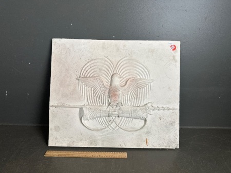 National Emblem of PNG in Plaster - a bird-of-paradise over a traditional spear and a kundu drum