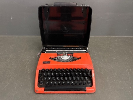 Vintage Orange and Black Brother 210 Typewriter