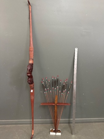 Hand Carved Wooden Bow with Indian Style Arrows on Wooden Stand